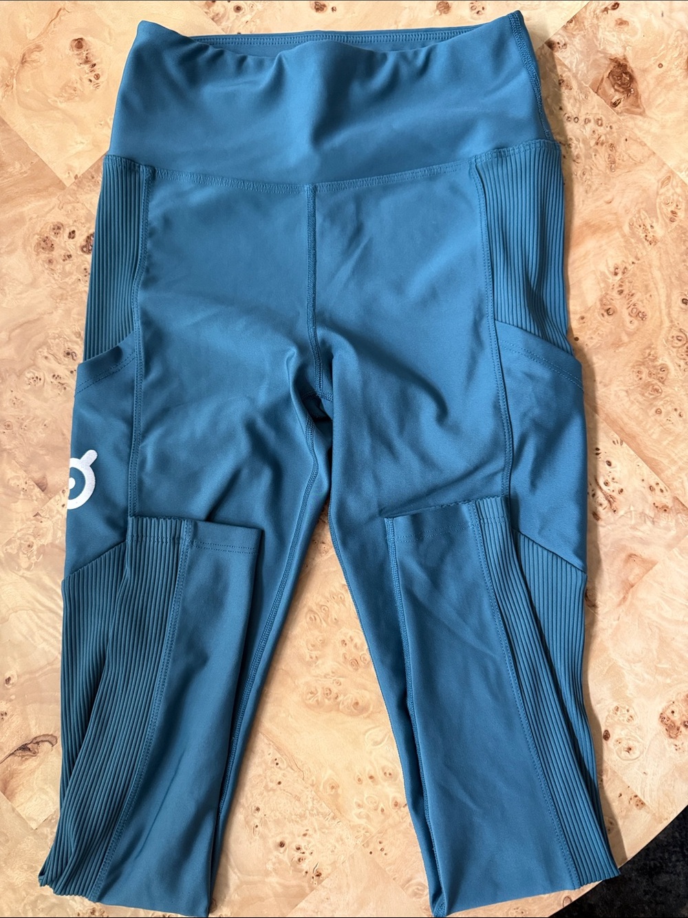 Peloton teal workout leggings with built in pockets; Size medium